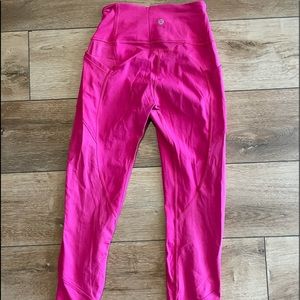 Hot pink cropped lululemon leggings with pockets